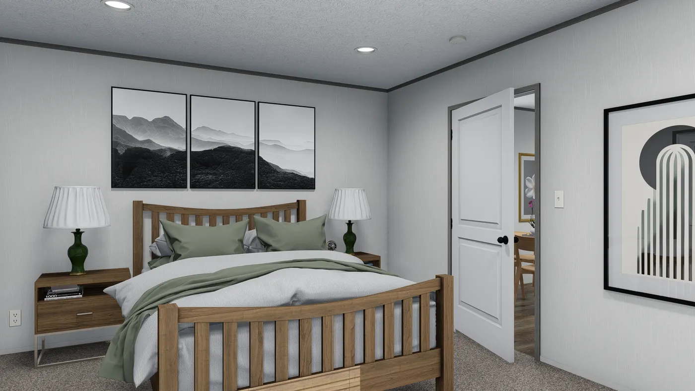 The SHOWER HOUSE Primary Bedroom. This Manufactured Mobile Home features 3 bedrooms and 2 baths.