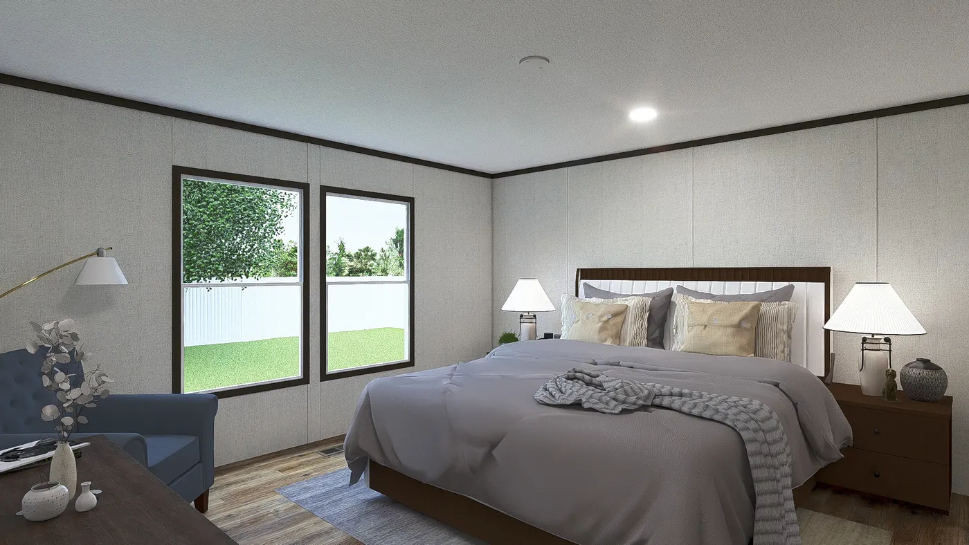 The EMPOWER Primary Bedroom. This Manufactured Mobile Home features 4 bedrooms and 2 baths.