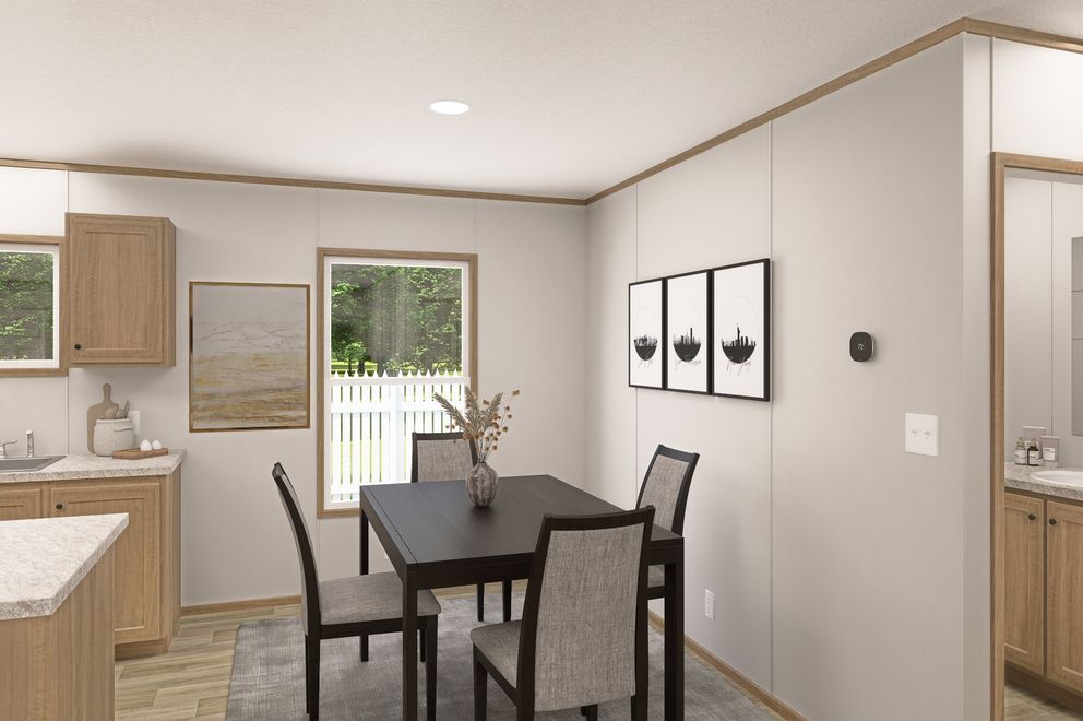 The THE EAGLE 52 Dining Room. This Manufactured Mobile Home features 3 bedrooms and 2 baths.