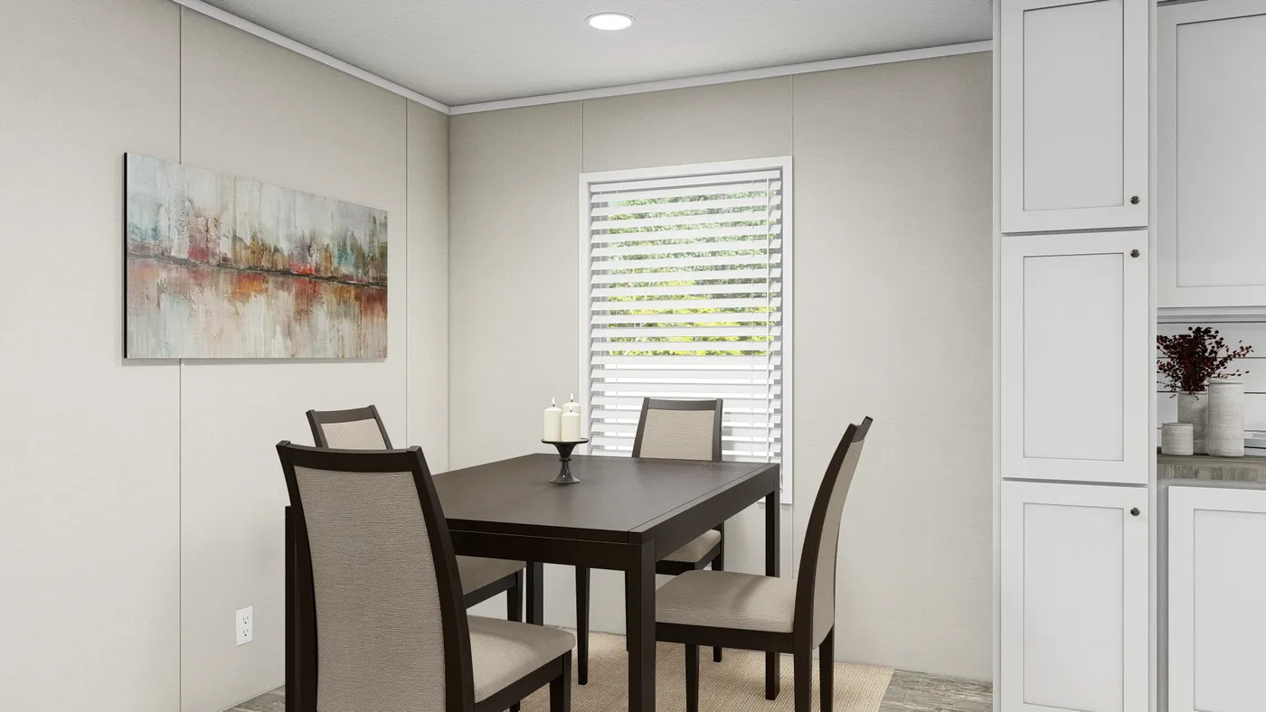 The ULTRA BREEZE 28X52 Dining Area. This Manufactured Mobile Home features 3 bedrooms and 2 baths.