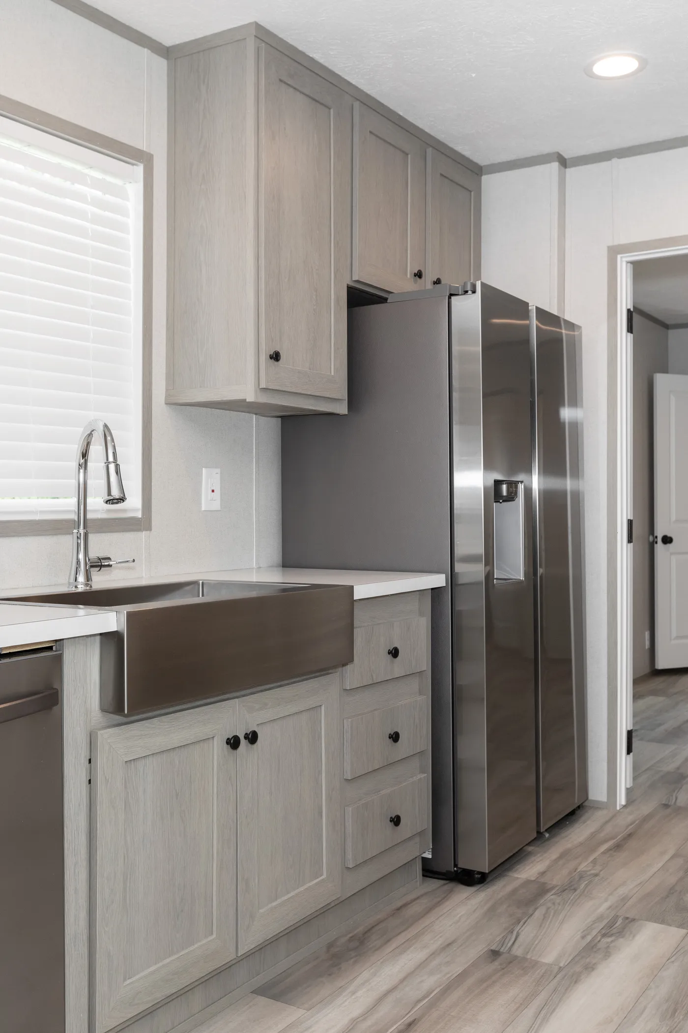 The THE ANNIVERSARY 76 Kitchen. This Manufactured Mobile Home features 3 bedrooms and 2 baths.