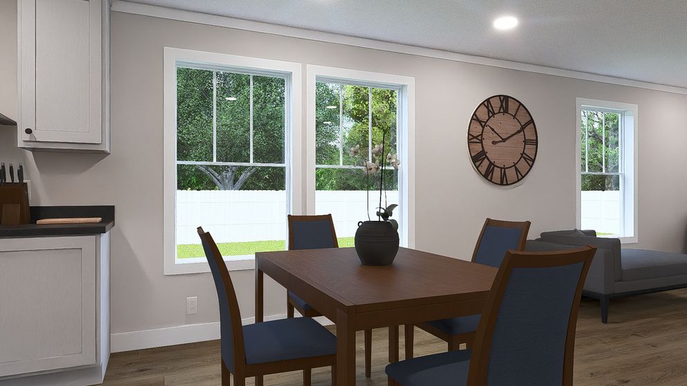 The MY GIRL Dining Area. This Manufactured Mobile Home features 3 bedrooms and 2 baths.