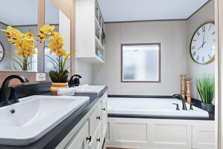 The ANNIVERSARY 16763A Primary Bathroom. This Manufactured Mobile Home features 3 bedrooms and 2 baths.