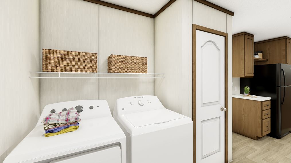 The ESSENCE Utility Room. This Manufactured Mobile Home features 3 bedrooms and 2 baths.