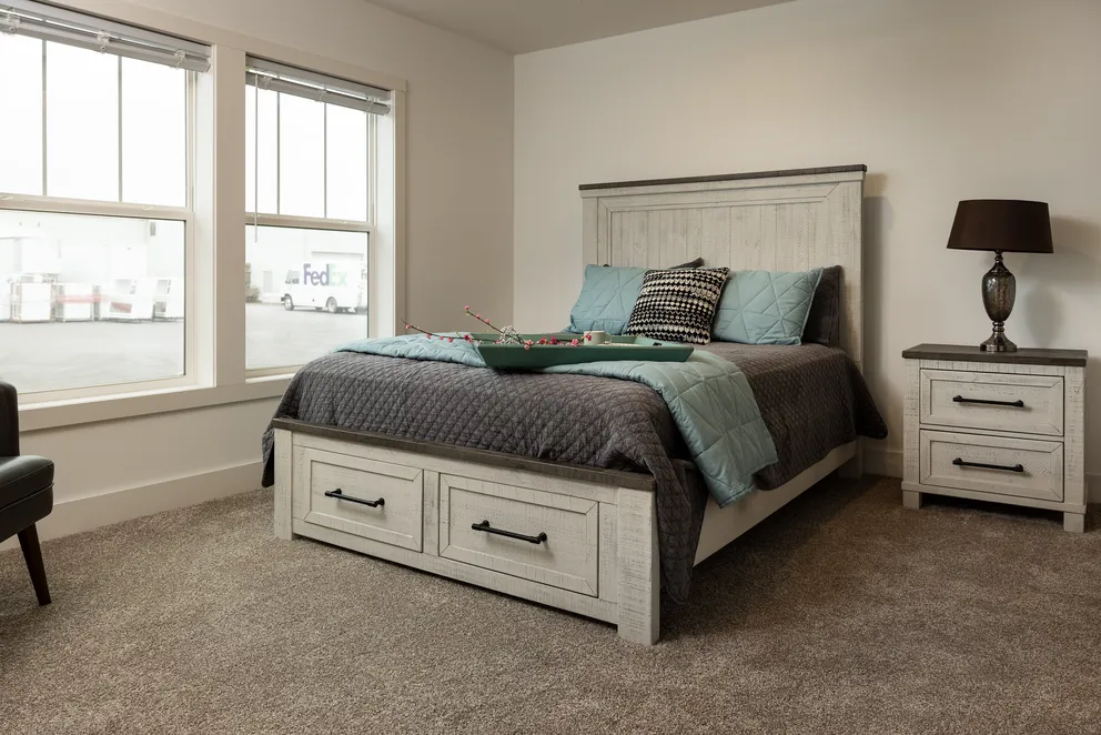 The HEY JUDE Primary Bedroom. This Manufactured Mobile Home features 4 bedrooms and 2 baths.