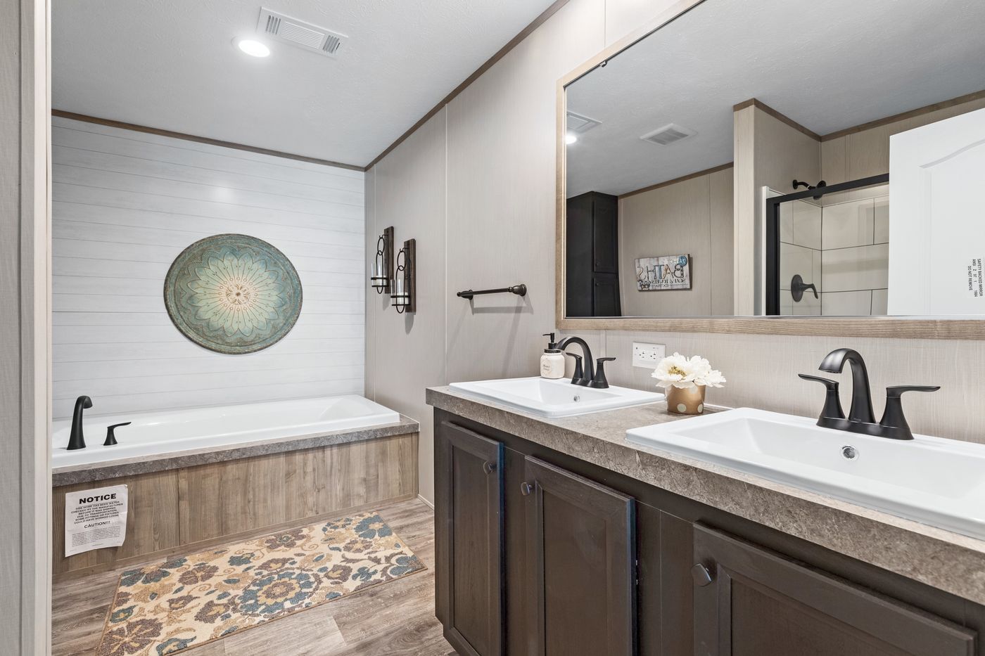 The CRAZY EIGHTS Primary Bathroom. This Manufactured Mobile Home features 4 bedrooms and 2 baths.