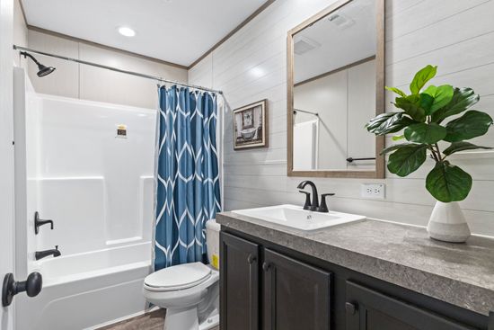 The CRAZY EIGHTS Guest Bathroom. This Manufactured Mobile Home features 4 bedrooms and 2 baths.