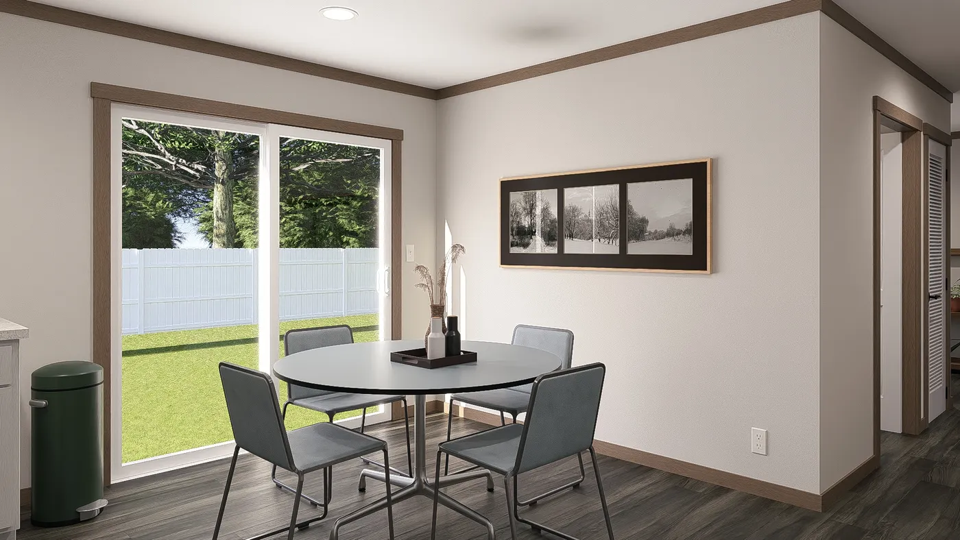 The WILDER Dining Area. This Manufactured Mobile Home features 3 bedrooms and 2 baths.