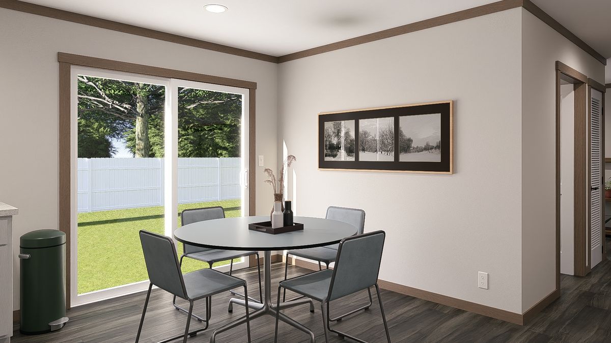 The WILDER Dining Area. This Manufactured Mobile Home features 3 bedrooms and 2 baths.