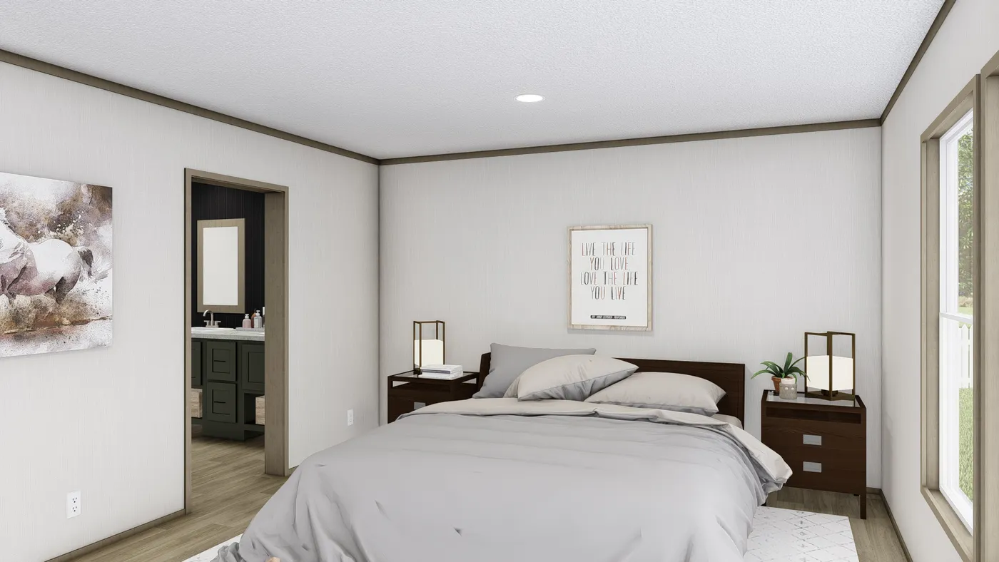 The COOK Primary Bedroom. This Manufactured Mobile Home features 3 bedrooms and 2 baths.