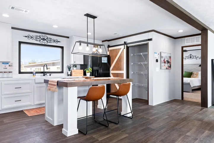 The BREEZE FARMHOUSE Kitchen. This Manufactured Mobile Home features 3 bedrooms and 2 baths.
