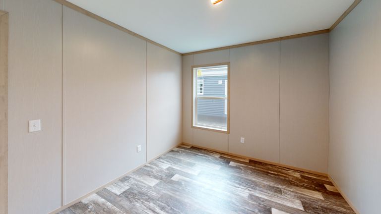 The HANCOCK Guest Bedroom. This Manufactured Mobile Home features 4 bedrooms and 2 baths.