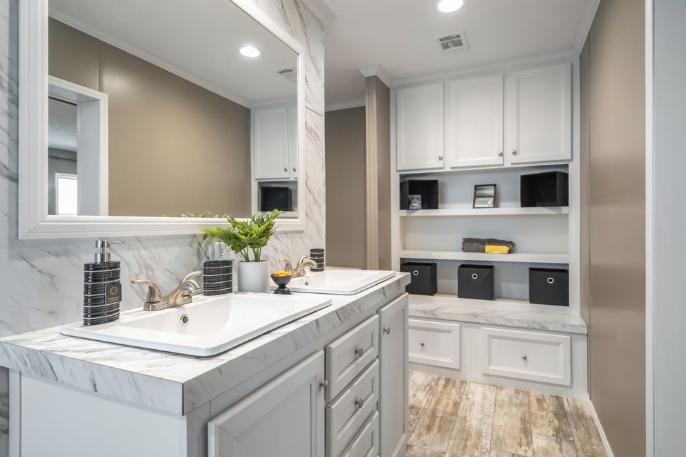 The CASCADE Primary Bathroom. This Manufactured Mobile Home features 4 bedrooms and 2 baths.