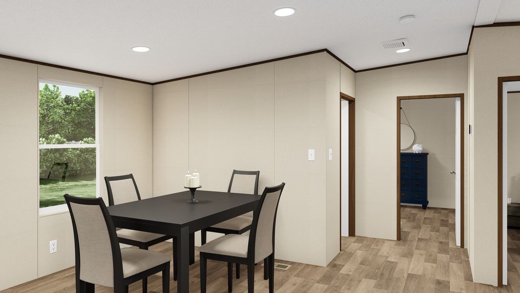 The THRILL Dining Room. This Manufactured Mobile Home features 3 bedrooms and 2 baths.