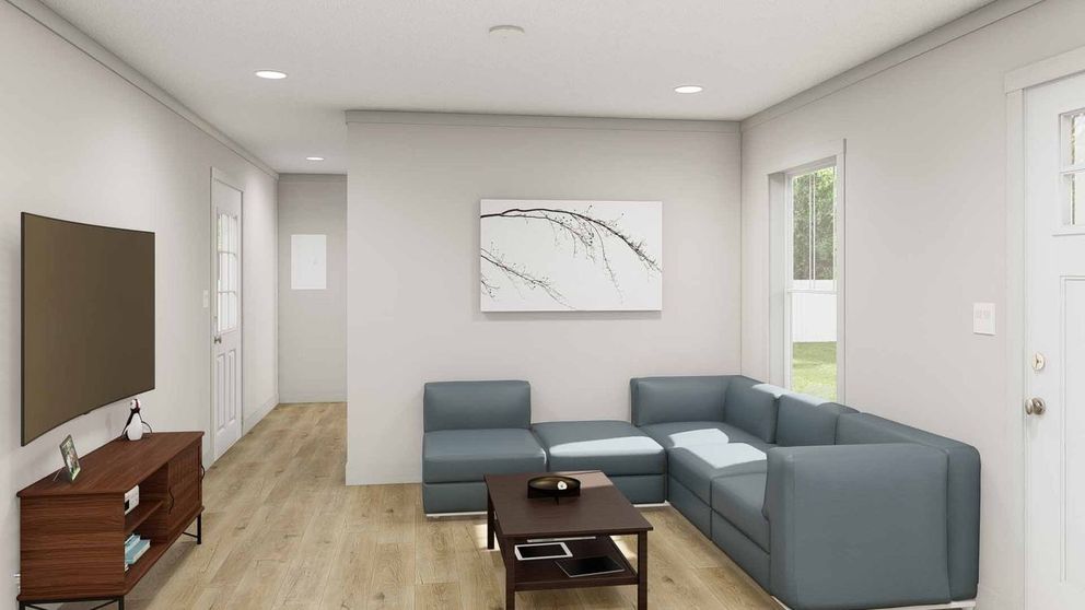 The GOOD VIBRATIONS Living Room. This Manufactured Mobile Home features 3 bedrooms and 2 baths.