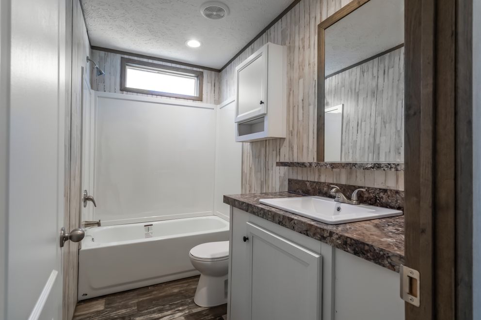 The NUMBER ONE Exterior. This Manufactured Mobile Home features 3 bedrooms and 2 baths.