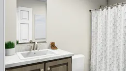The CAROLINIAN M5010 Guest Bathroom. This Manufactured Mobile Home features 3 bedrooms and 2 baths.
