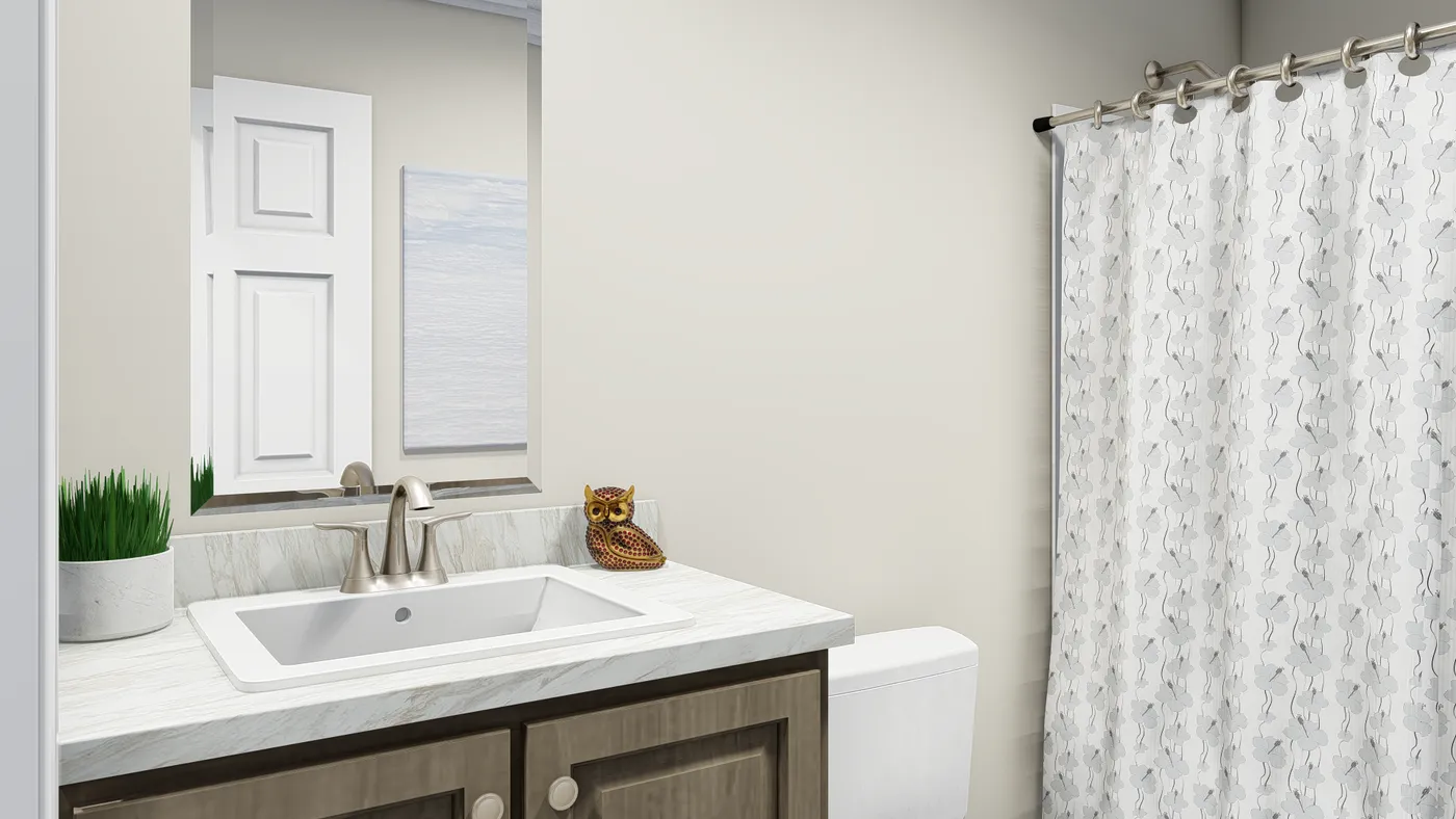 The CAROLINIAN M5010 Guest Bathroom. This Manufactured Mobile Home features 3 bedrooms and 2 baths.