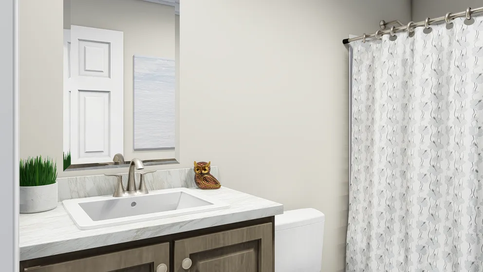 The CAROLINIAN M5010 Guest Bathroom. This Manufactured Mobile Home features 3 bedrooms and 2 baths.