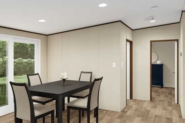 The TRIUMPH Dining Area. This Manufactured Mobile Home features 5 bedrooms and 3 baths.