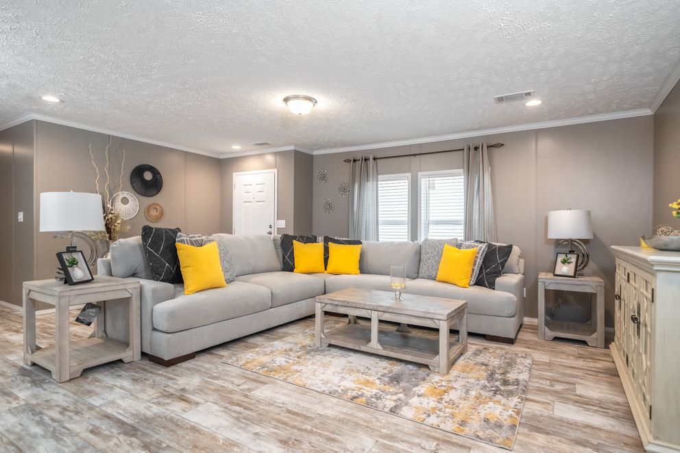 The CASCADE Living Room. This Manufactured Mobile Home features 4 bedrooms and 2 baths.