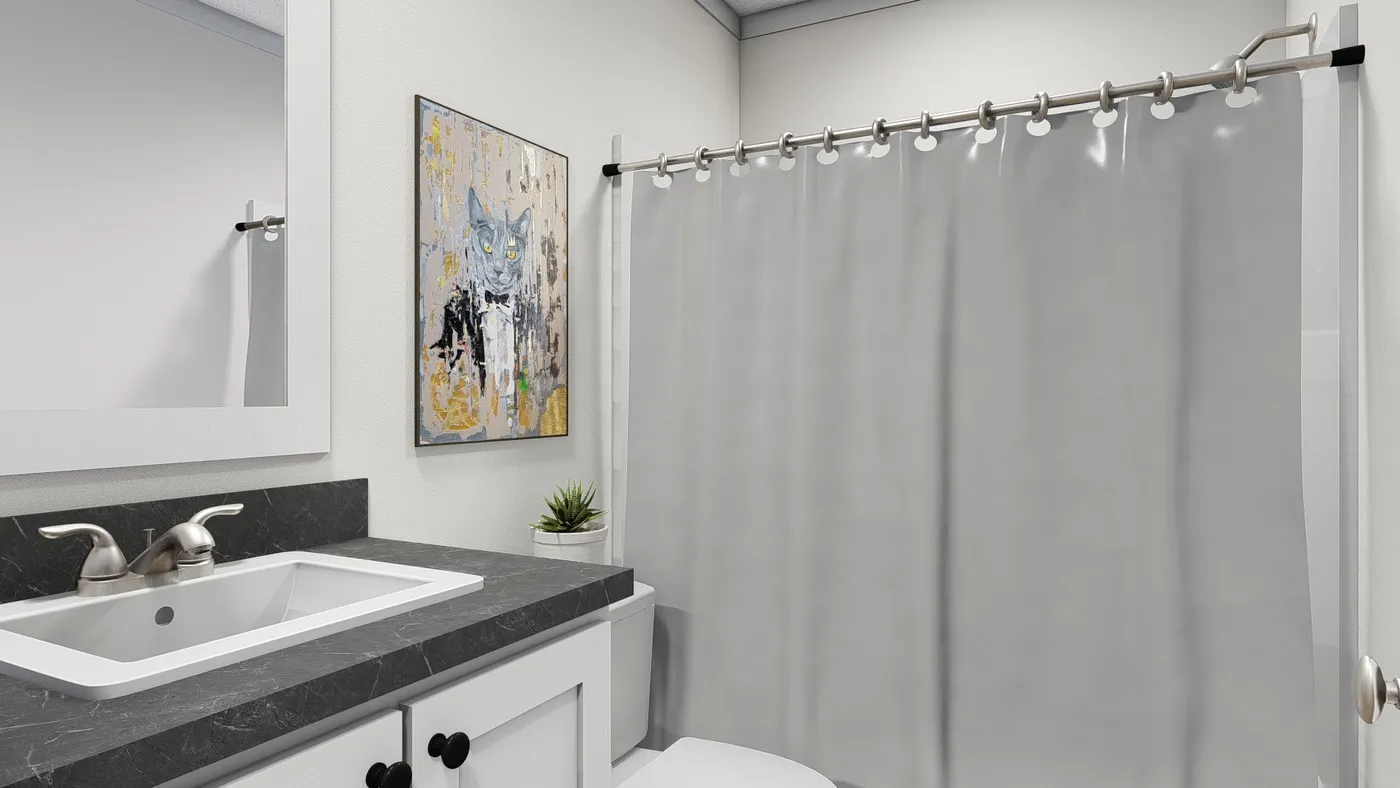 The BORN TO RUN Guest Bathroom. This Manufactured Mobile Home features 2 bedrooms and 2 baths.