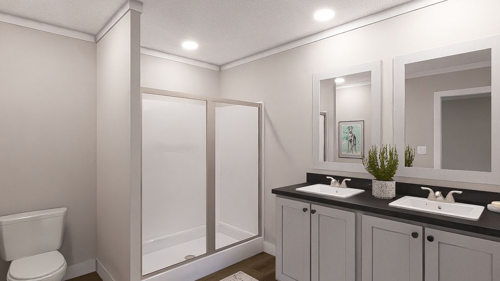 The SWEET CAROLINE Primary Bathroom. This Manufactured Mobile Home features 3 bedrooms and 2 baths.