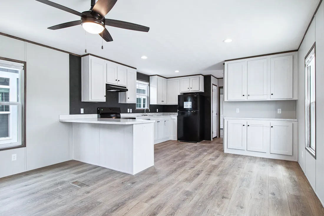 The HOMESTEAD 16562A Kitchen. This Manufactured Mobile Home features 2 bedrooms and 2 baths.