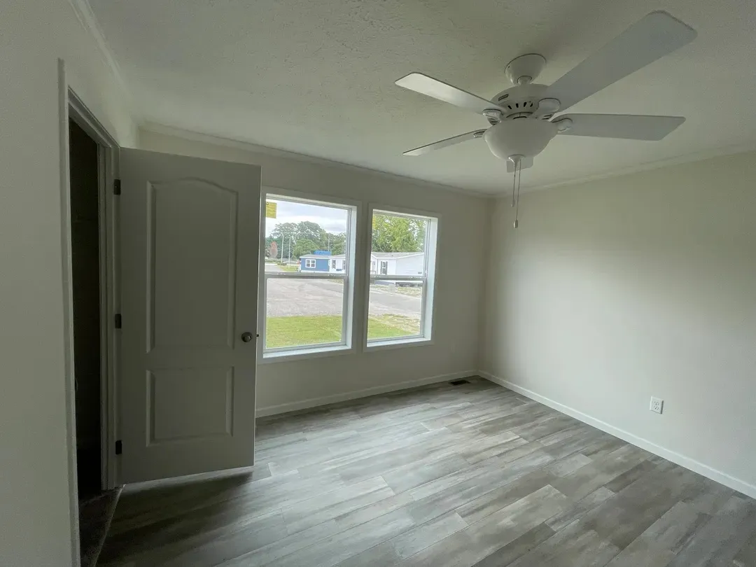 The MOONSTONE Primary Bedroom. This Manufactured Mobile Home features 3 bedrooms and 2 baths.