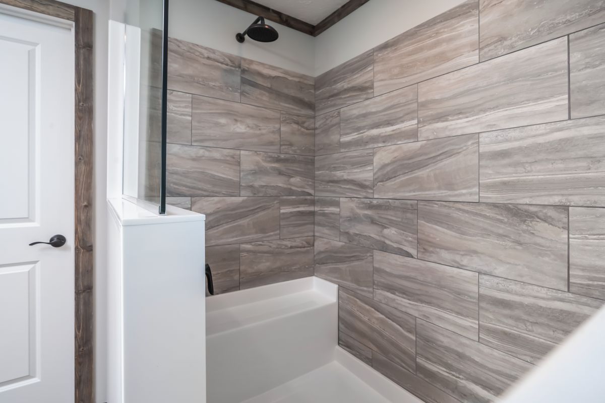 The THE JACKSON Primary Bathroom. This Manufactured Mobile Home features 4 bedrooms and 2 baths.