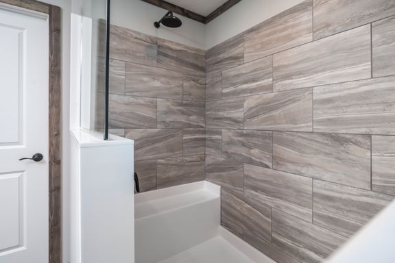 The THE JACKSON Primary Bathroom. This Manufactured Mobile Home features 4 bedrooms and 2 baths.