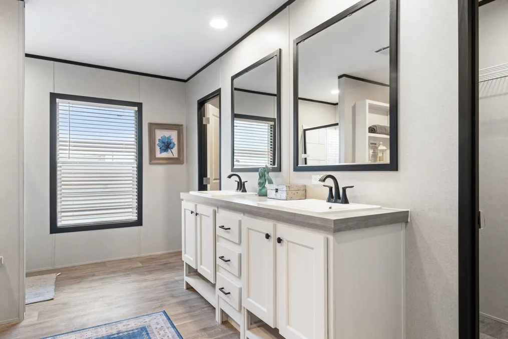 The HERCULES Primary Bathroom. This Manufactured Mobile Home features 4 bedrooms and 2 baths.