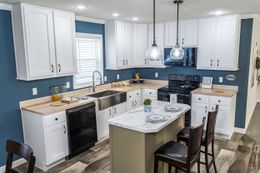The BROOKLINE FLEX 32 WIDE Kitchen. This Manufactured Mobile Home features 4 bedrooms and 3 baths.