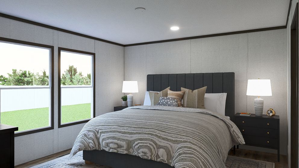 The GLIMPSE Primary Bedroom. This Manufactured Mobile Home features 3 bedrooms and 2 baths.