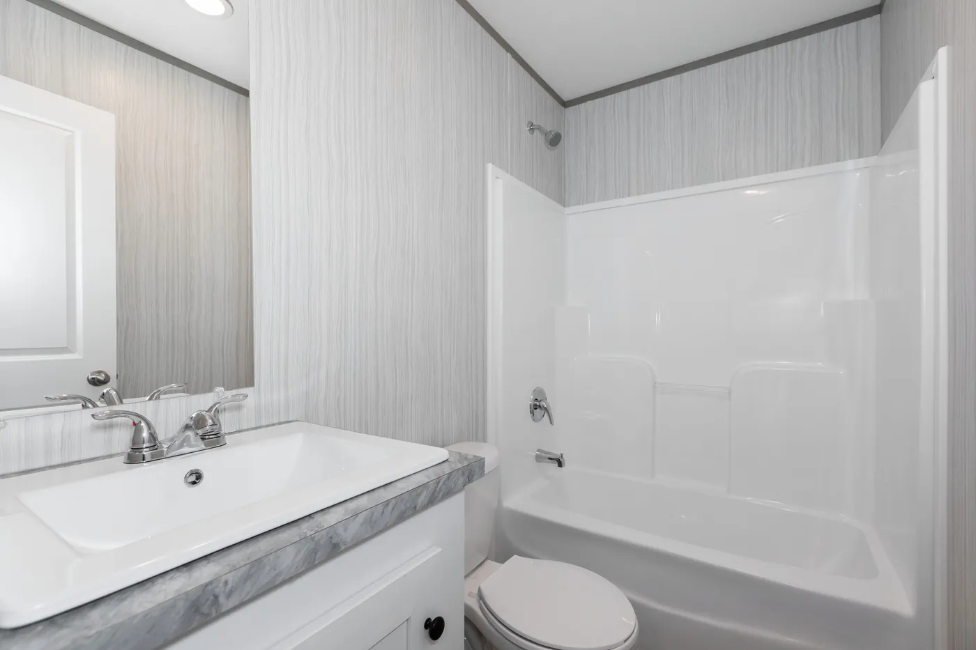 The THE ULTIMATE SHOWER Guest Bathroom. This Manufactured Mobile Home features 3 bedrooms and 2 baths.
