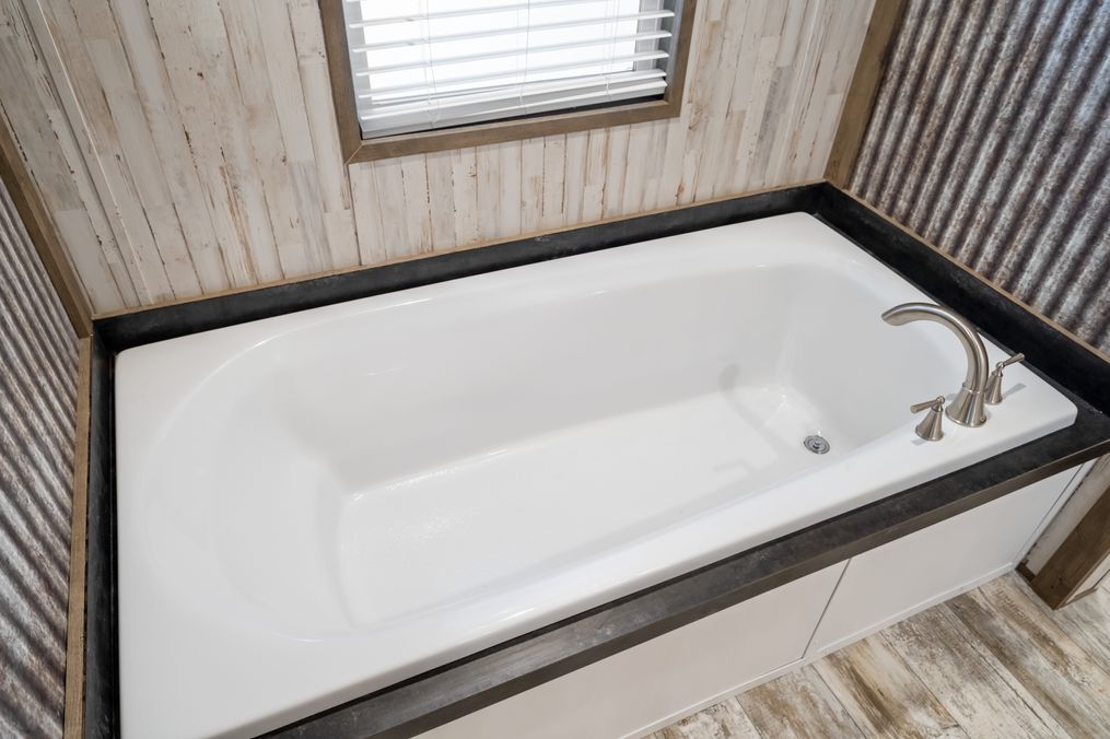 The ANNIVERSARY SPLASH Primary Bathroom. This Manufactured Mobile Home features 3 bedrooms and 2 baths.
