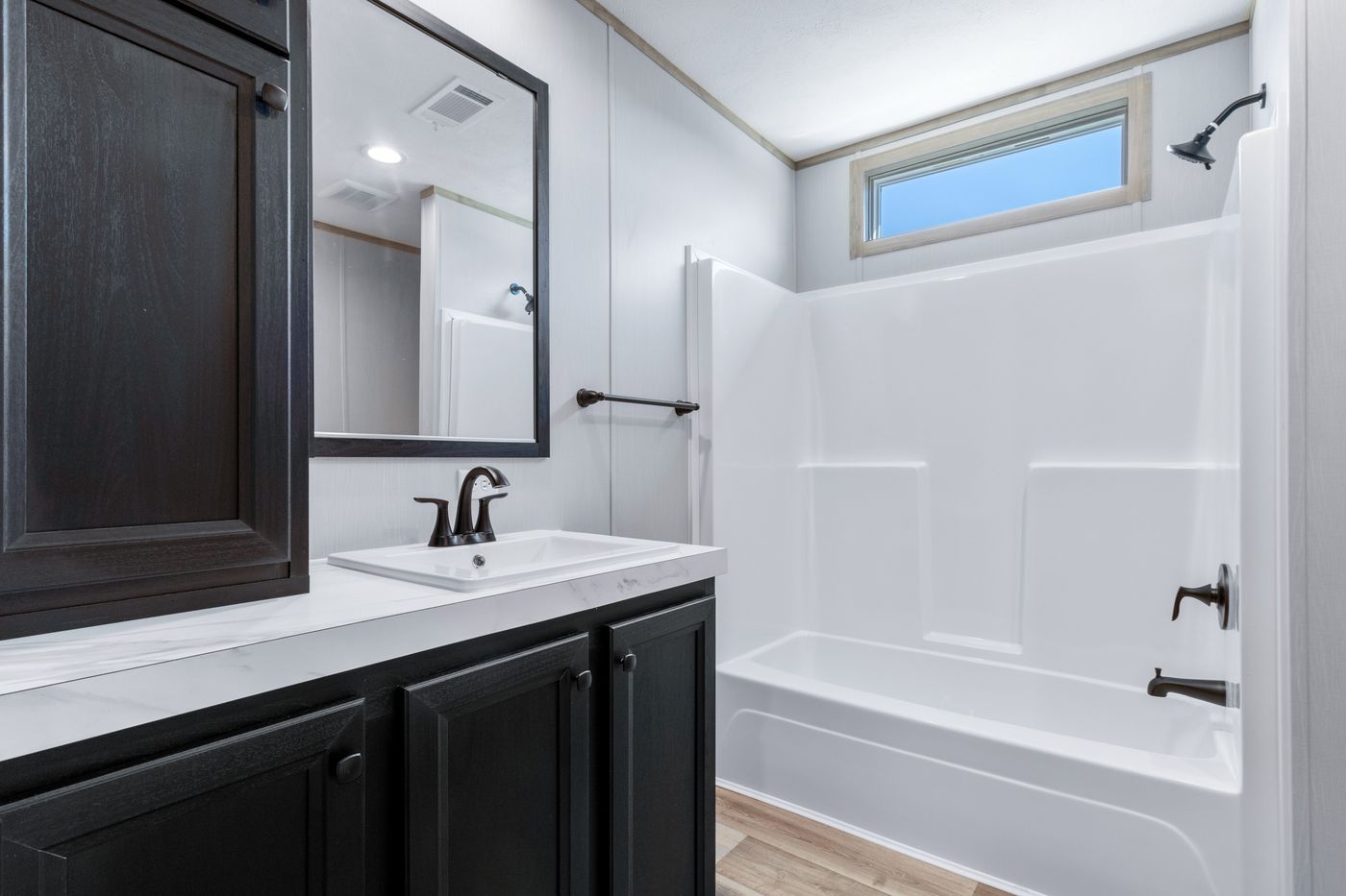 The ANATOLIA XL Guest Bathroom. This Manufactured Mobile Home features 3 bedrooms and 2 baths.