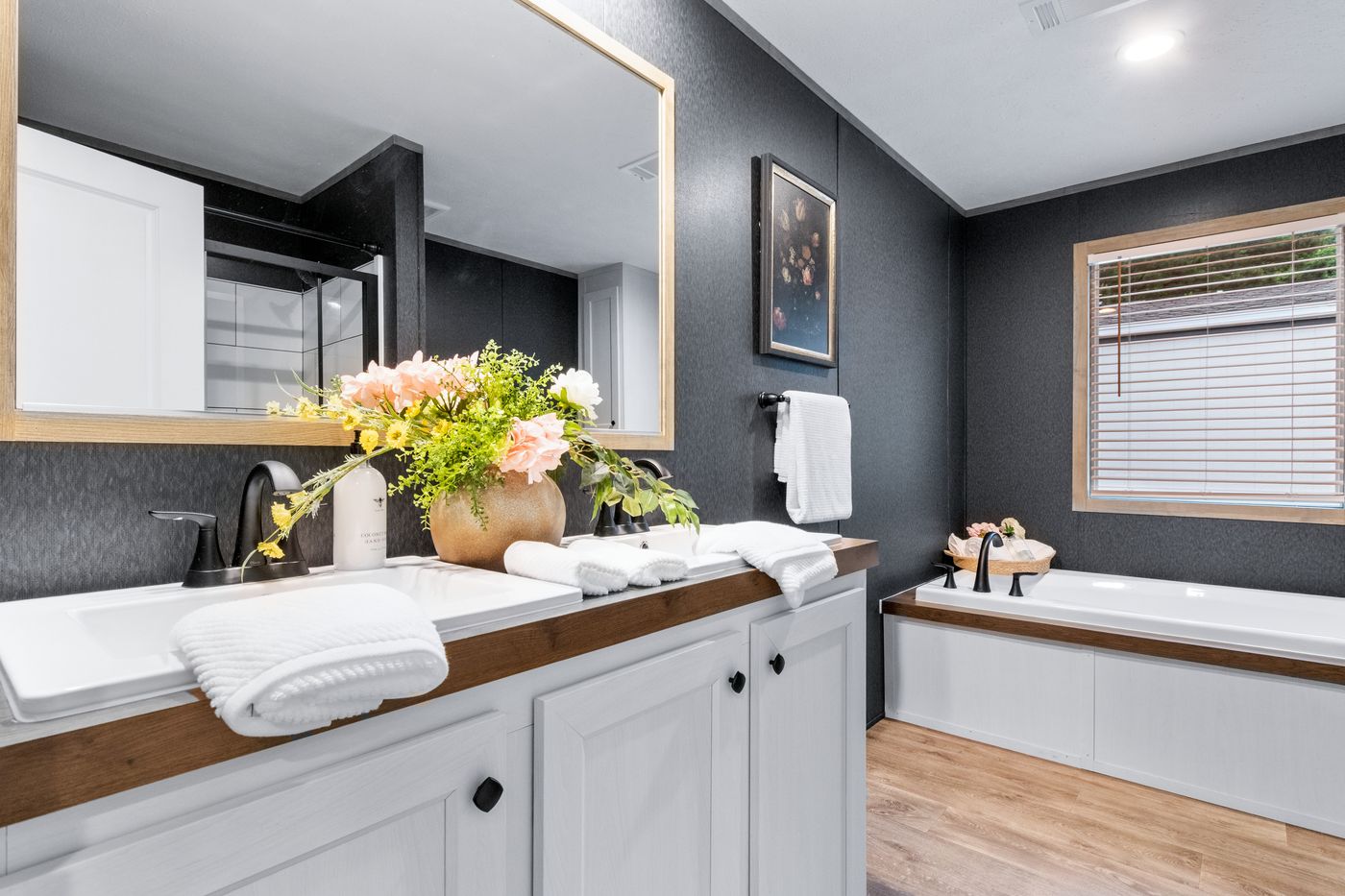 The EL SUENO BREEZE Primary Bathroom. This Manufactured Mobile Home features 4 bedrooms and 2 baths.