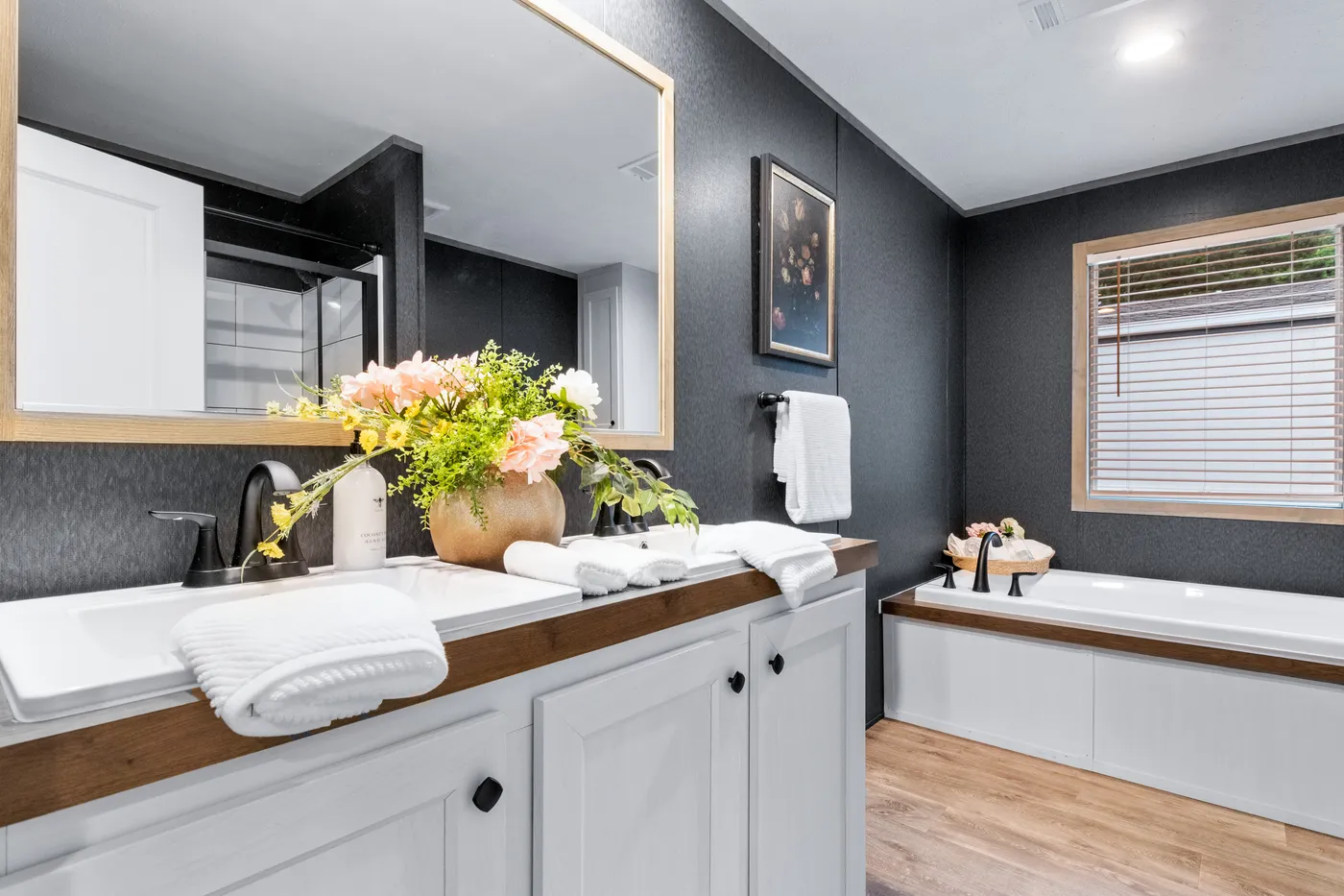 The EL SUENO BREEZE Primary Bathroom. This Manufactured Mobile Home features 4 bedrooms and 2 baths.