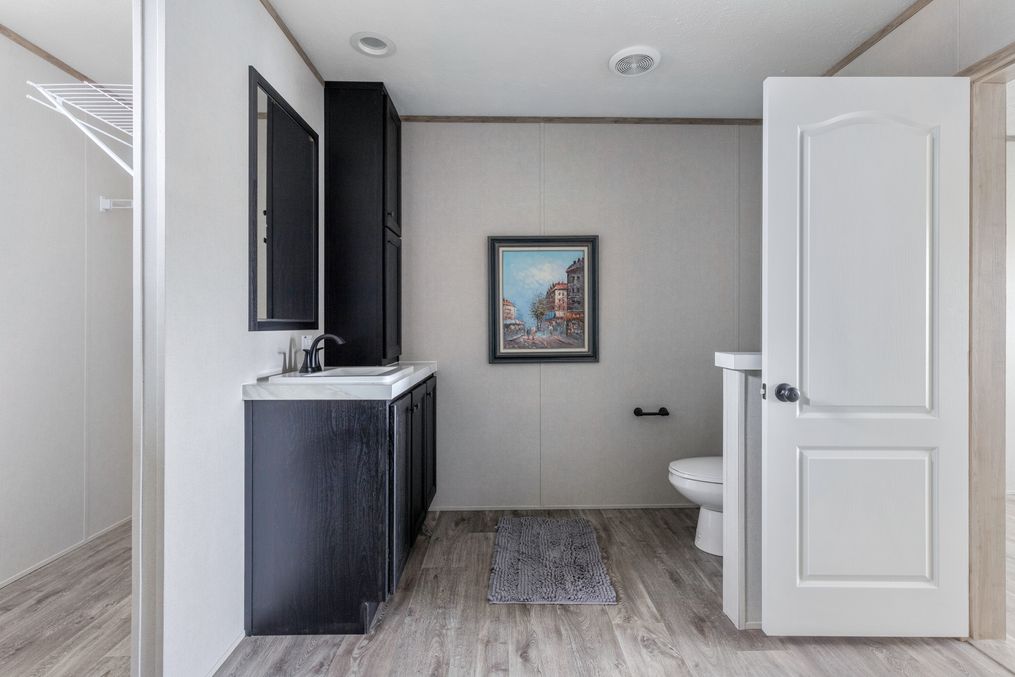 The STERLING XL ANNIVERSARY Primary Bathroom. This Manufactured Mobile Home features 3 bedrooms and 2 baths.