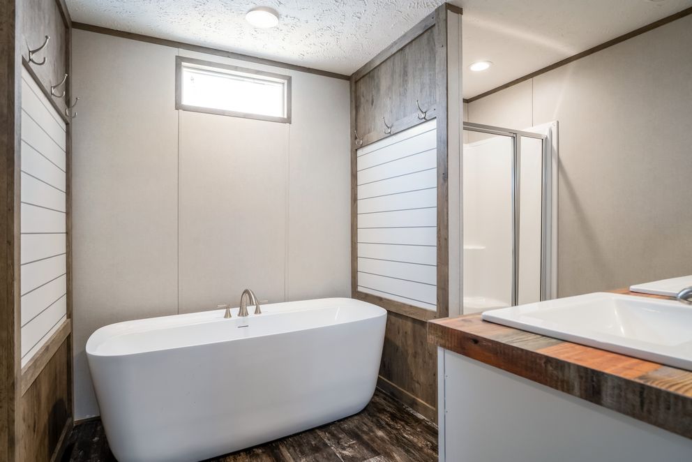 The ANNIVERSARY ENTERTAINER Exterior. This Manufactured Mobile Home features 3 bedrooms and 2 baths.