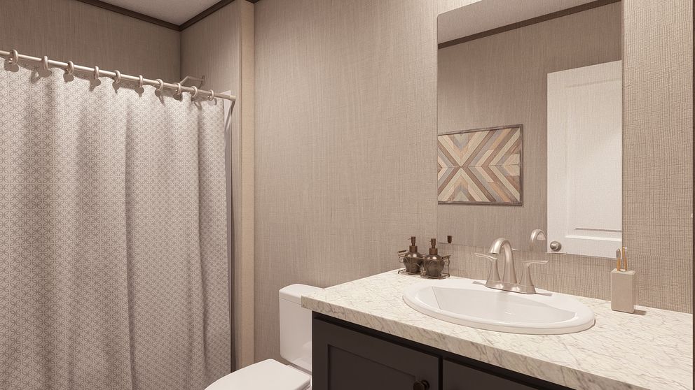 The LEGEND 28X56 4 BR Guest Bathroom. This Manufactured Mobile Home features 4 bedrooms and 2 baths.