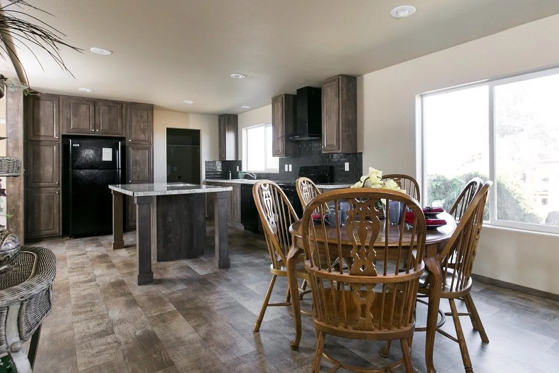 The 2022 COLUMBIA RIVER (NEW) Dining Area. This Manufactured Mobile Home features 3 bedrooms and 2 baths.