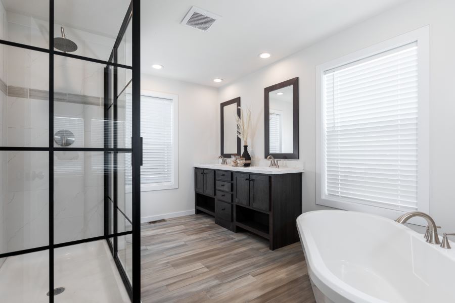The BUTLER PLACE/6428-MS056 SECT Primary Bathroom. This Manufactured Mobile Home features 3 bedrooms and 3 baths.