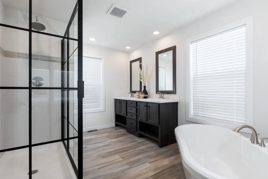 The BUTLER PLACE/6428-MS056 SECT Primary Bathroom. This Manufactured Mobile Home features 3 bedrooms and 3 baths.