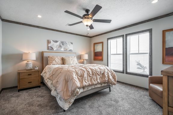 The THE JACKSON Primary Bedroom. This Manufactured Mobile Home features 4 bedrooms and 2 baths.