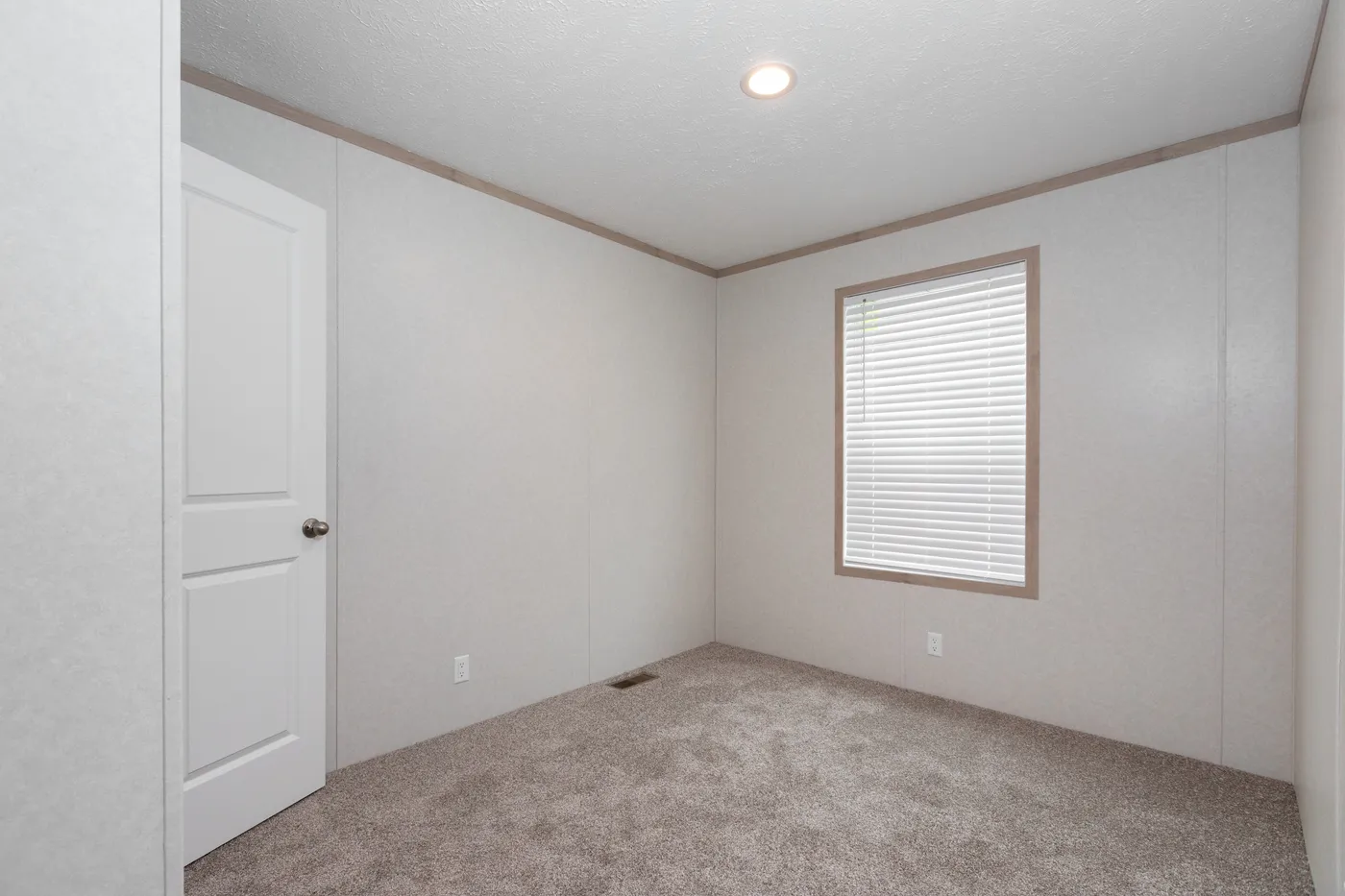 The 7616-4200 ADRENALINE Guest Bedroom. This Manufactured Mobile Home features 3 bedrooms and 2 baths.