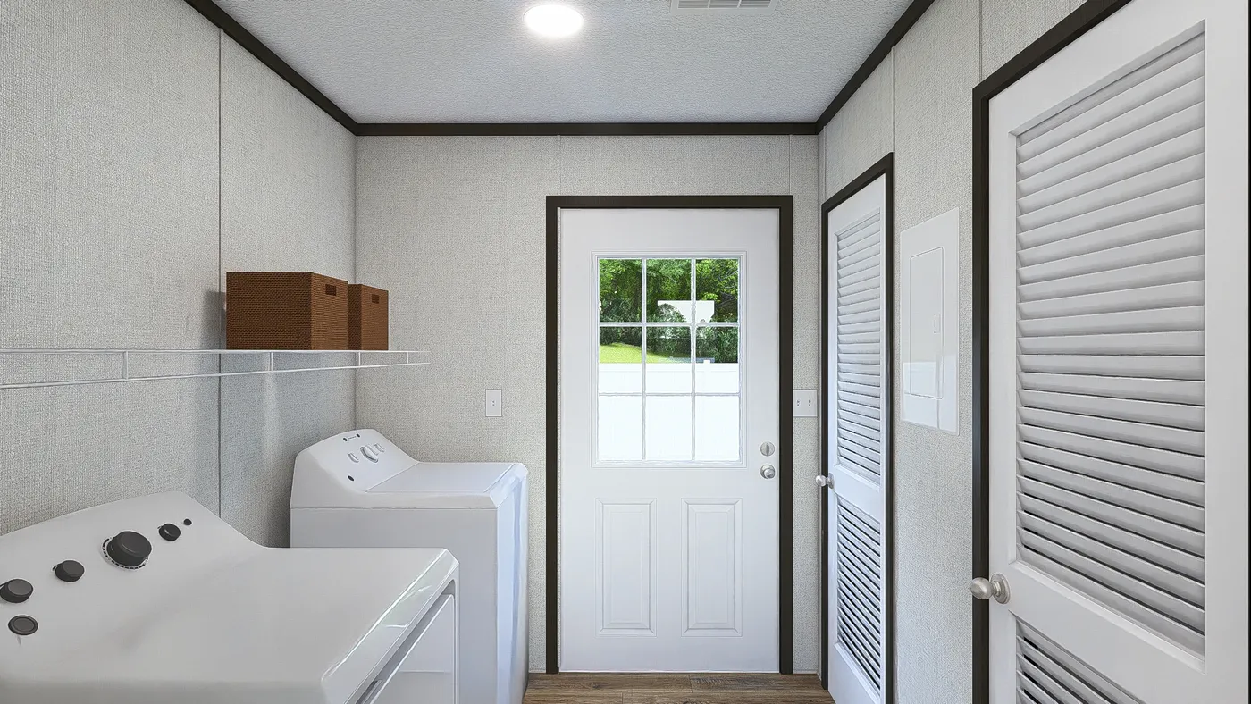 The GRAND Utility Room. This Manufactured Mobile Home features 3 bedrooms and 2 baths.