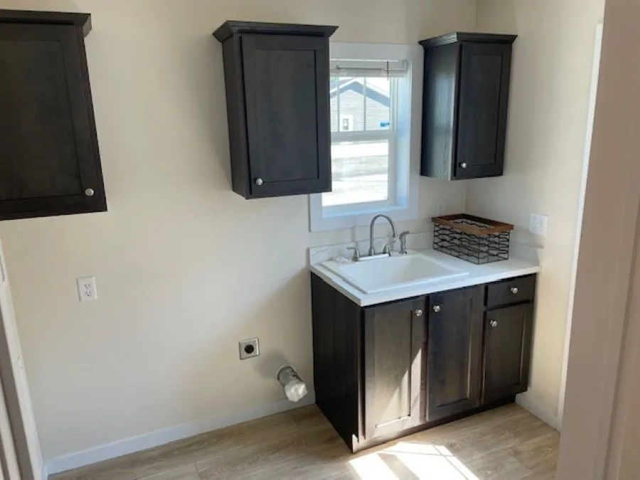 The SOMERSET DR/5228-MS012-1 SECT Utility Room. This Manufactured Mobile Home features 3 bedrooms and 2 baths.