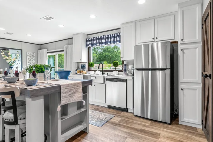 The THE ANNIVERSARY 2.1 Kitchen. This Manufactured Mobile Home features 3 bedrooms and 2 baths.